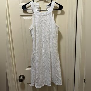 White dress. Straps around the neck. Size small.